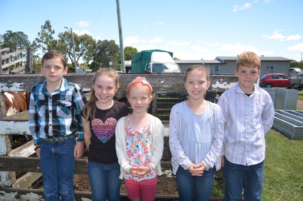 Dylan Collins, Jessica, Leah and Kate Cleland and Logan Collins check out the animals at the saleyards. 